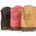 Ankle boot shoes in suede leather with fringed detail.