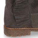 Ankle boot shoes in suede leather with fringed detail.