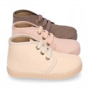 Kids canvas Casual Bootie shoes with laces in pastel colors.