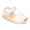 Patent leather Menorquina sandals with hook and loop strap.