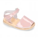 Patent leather Menorquina sandals with hook and loop strap.