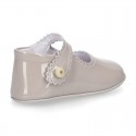 Patent leather Mary Janes for babies with button.