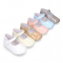 Patent leather Mary Janes for babies with button.