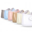 Patent leather Mary Janes for babies with button.