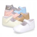 Patent leather Mary Janes for babies with button.