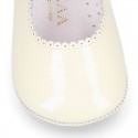 Patent leather Mary Janes for babies with button.