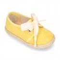 Spring summer canvas Laces up shoes espadrille style with ties closure.