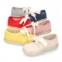 Spring summer canvas Laces up shoes espadrille style with ties closure.