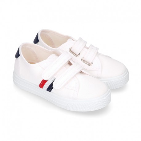 Cotton canvas kids tennis shoes to dress laceless with flag design.