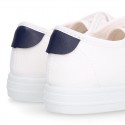 Cotton canvas kids tennis shoes to dress laceless with flag design.