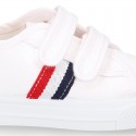 Cotton canvas kids tennis shoes to dress laceless with flag design.