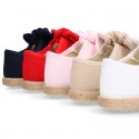 Cotton canvas espadrille shoes little Mary Jane style with hook and loop strap and bow.