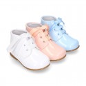 Classic patent leather ankle boots to dress with ties closure in PASTEL COLORS.