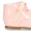 Classic patent leather ankle boots to dress with ties closure in PASTEL COLORS.
