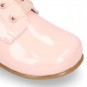 Classic patent leather ankle boots to dress with ties closure in PASTEL COLORS.