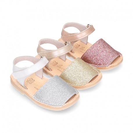 Shiny soft leather kids menorquina sandals with hook and loop strap.