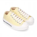 Cotton canvas Sneaker shoes with shoelaces and with toe cap in pastel colors.