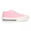 Cotton canvas Sneaker shoes with shoelaces and with toe cap in pastel colors.