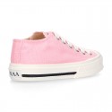 Cotton canvas Sneaker shoes with shoelaces and with toe cap in pastel colors.