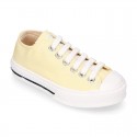 Cotton canvas Sneaker shoes with shoelaces and with toe cap in pastel colors.