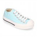 Cotton canvas Sneaker shoes with shoelaces and with toe cap in pastel colors.