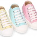 Cotton canvas Sneaker shoes with shoelaces and with toe cap in pastel colors.