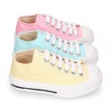 Cotton canvas Sneaker shoes with shoelaces and with toe cap in pastel colors.