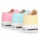 Cotton canvas Sneaker shoes with shoelaces and with toe cap in pastel colors.