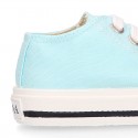 Cotton canvas Sneaker shoes with shoelaces and with toe cap in pastel colors.