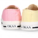 Cotton canvas Sneaker shoes with shoelaces and with toe cap in pastel colors.