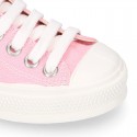 Cotton canvas Sneaker shoes with shoelaces and with toe cap in pastel colors.