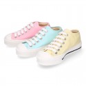 Cotton canvas Sneaker shoes with shoelaces and with toe cap in pastel colors.