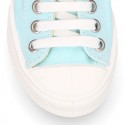 Cotton canvas Sneaker shoes with shoelaces and with toe cap in pastel colors.