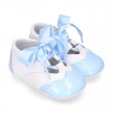 English style shoes in combined patent leather for babies.