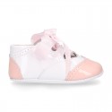 English style shoes in combined patent leather for babies.