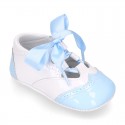 English style shoes in combined patent leather for babies.