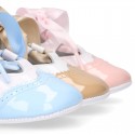 English style shoes in combined patent leather for babies.