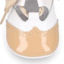 English style shoes in combined patent leather for babies.