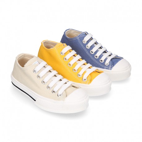 Cotton canvas OKAA Sneaker shoes with shoelaces and with toe cap in trendy colors.