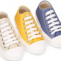 Cotton canvas OKAA Sneaker shoes with shoelaces and with toe cap in trendy colors.