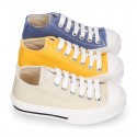 Cotton canvas OKAA Sneaker shoes with shoelaces and with toe cap in trendy colors.