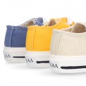 Cotton canvas OKAA Sneaker shoes with shoelaces and with toe cap in trendy colors.