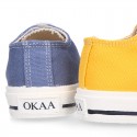 Cotton canvas OKAA Sneaker shoes with shoelaces and with toe cap in trendy colors.