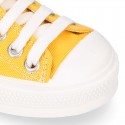 Cotton canvas OKAA Sneaker shoes with shoelaces and with toe cap in trendy colors.