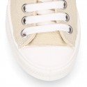 Cotton canvas OKAA Sneaker shoes with shoelaces and with toe cap in trendy colors.