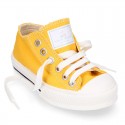 Cotton canvas OKAA Sneaker shoes with shoelaces and with toe cap in trendy colors.