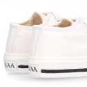 White Cotton canvas OKAA Sneaker shoes with shoelaces and toe cap.