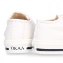 White Cotton canvas OKAA Sneaker shoes with shoelaces and toe cap.