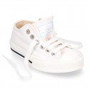 White Cotton canvas OKAA Sneaker shoes with shoelaces and toe cap.