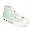 Cotton canvas High Sneaker shoes with shoelaces and with toe cap in pastel colors.